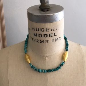 Necklace with turquoise and gold beads.
